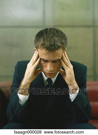 Businessman holding head, portrait View Large Photo Image Stock Photo - Businessman holding head, portrait. Fotosearch