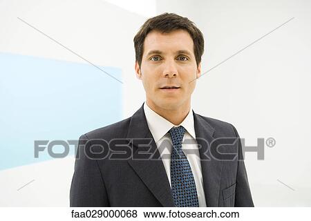 Businessman looking at camera, portrait View Large Photo Image Stock Photo - Businessman looking at camera, portrait. Fotosearch