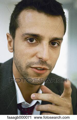 Businessman pointing, portrait View Large Photo Image Stock Image - Businessman pointing, portrait. Fotosearch