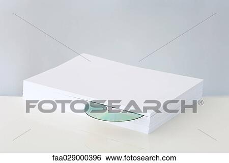 CD emerging from stack of paper View Large Photo Image Stock Photograph - CD emerging from stack of paper. Fotosearch