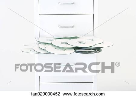 CDs spilling out of filing cabinet drawer View Large Photo Image Stock Image - CDs spilling out of filing cabinet drawer. Fotosearch