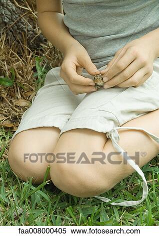 Child holding toad on lap View Large Photo Image Stock Photography - Child holding toad on lap. Fotosearch