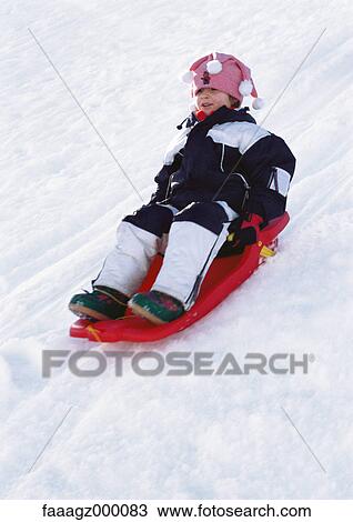 Child sledding View Large Photo Image Stock Image - Child sledding. Fotosearch