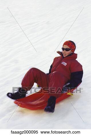 Stock Photography - Child sledding. Fotosearch