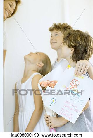 Children giving woman mother's day surprise View Large Photo Image Stock Photo - Children giving woman mother's day surprise. Fotosearch