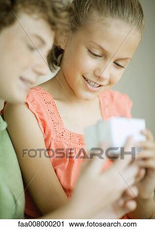 Children with gift View Large Photo Image Stock Image - Children with gift. Fotosearch