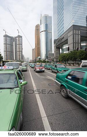 China, Guangzhou, city traffic, high rise buildings in background View Large Photo Image Stock Photo - China, Guangzhou, city traffic, high rise buildings in background. Fotosearch