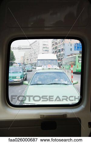 China, Guangzhou, city traffic, viewed through rear car window View Large Photo Image Stock Photo - China, Guangzhou, city traffic, viewed through rear car window. Fotosearch