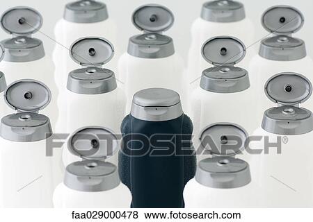 Closed black bottle among large group of opened white bottles View Large Photo Image Stock Photo - Closed black bottle among large group of opened white bottles. Fotosearch