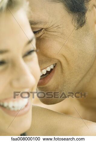 Couple laughing, close-up of faces View Large Photo Image Stock Image - Couple laughing, close-up of faces. Fotosearch