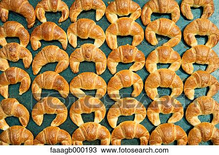 Croissants baking, full frame View Large Photo Image Stock Image - Croissants baking, full frame. Fotosearch