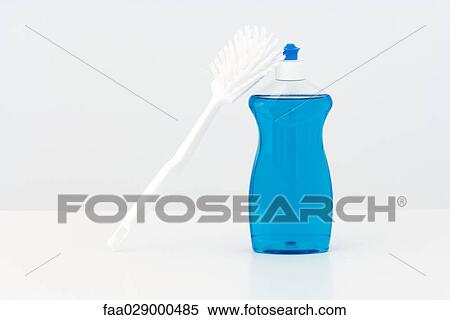 Dish brush leaning against bottle of dishwashing soap View Large Photo Image Stock Photography - Dish brush leaning against bottle of dishwashing soap. Fotosearch
