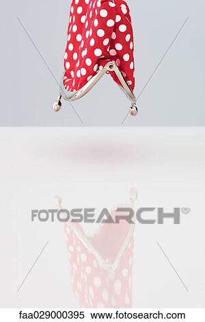 Stock Photography - Empty coin purse turned upside down. Fotosearch