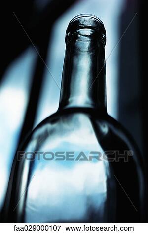 Empty wine bottle, low angle view View Large Photo Image Stock Photo - Empty wine bottle, low angle view. Fotosearch