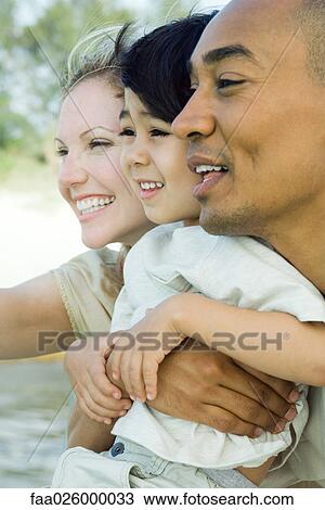 Family looking away together, smiling, side view View Large Photo Image Stock Image - Family looking away together, smiling, side view. Fotosearch