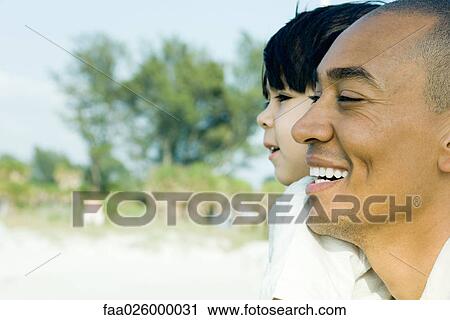 Father and son looking away together, smiling, side view View Large Photo Image Stock Image - Father and son looking away together, smiling, side view. Fotosearch