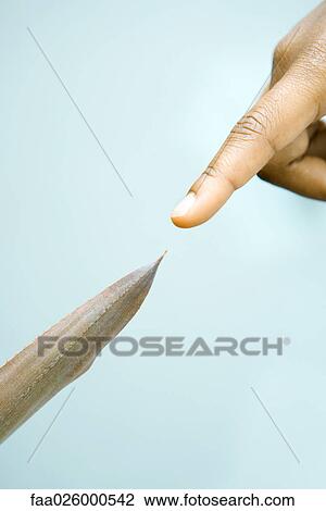 Finger pointing at tip of leaf, extreme close-up View Large Photo Image Stock Image - Finger pointing at tip of leaf, extreme close-up. Fotosearch