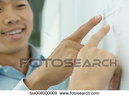 Fingers pointing to chart on wall View Large Photo Image Stock Photo - Fingers pointing to chart on wall. Fotosearch