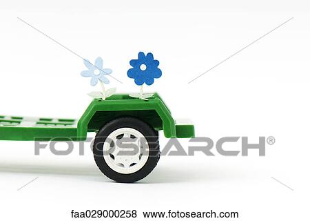 Flowers coming out of toy trailer View Large Photo Image Stock Photo - Flowers coming out of toy trailer. Fotosearch