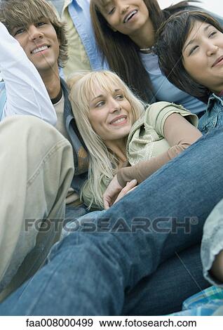 Friends hanging out together View Large Photo Image Stock Photo - Friends hanging out together. Fotosearch