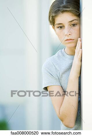 Girl leaning against wall View Large Photo Image Stock Image - Girl leaning against wall. Fotosearch