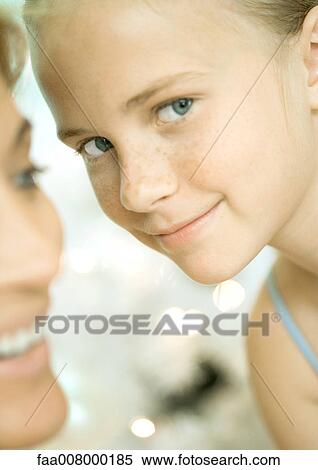 Girl near mother's face View Large Photo Image Stock Photography - Girl near mother's face. Fotosearch
