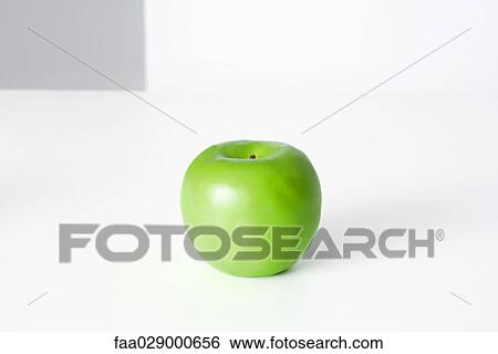 Stock Photograph - Green apple, close-up. Fotosearch