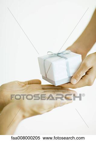 Hands giving and receiving gift View Large Photo Image Stock Photography - Hands giving and receiving gift. Fotosearch