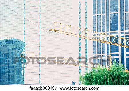 High rise relfected in glass facade View Large Photo Image Stock Photo - High rise relfected in glass facade. Fotosearch
