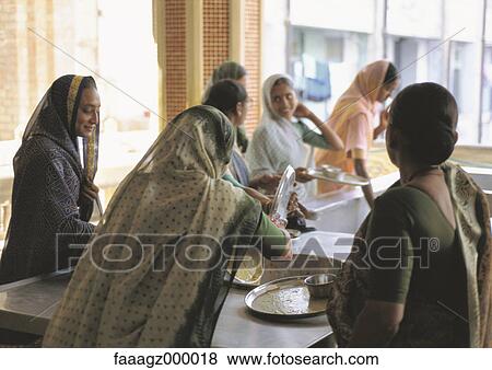 Stock Photo - India, Ahmedabad, women doing dishes. Fotosearch