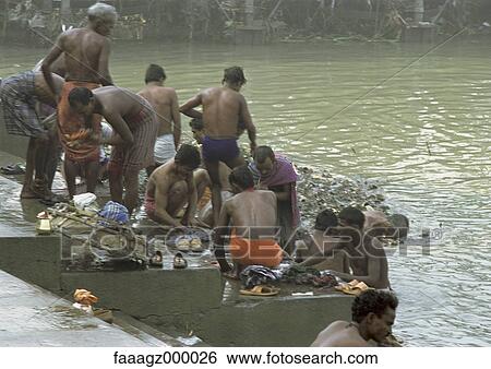 India, Calcutta, man washing by river View Large Photo Image Stock Photograph - India, Calcutta, man washing by river. Fotosearch