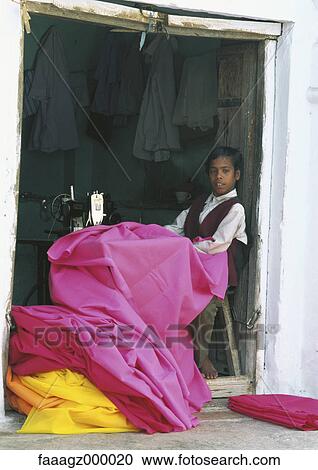 India, Pushkar, boy sewing View Large Photo Image Stock Image - India, Pushkar, boy sewing. Fotosearch