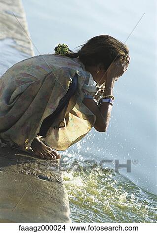 India, Sarkej, girl washing face by river View Large Photo Image Picture - India, Sarkej, girl washing face by river. Fotosearch
