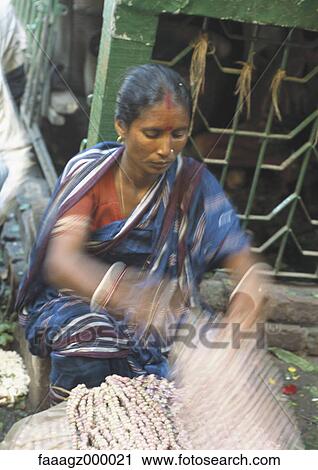 India, woman in market selling necklaces View Large Photo Image Stock Image - India, woman in market selling necklaces. Fotosearch