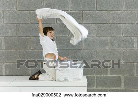 Little boy playing with laundry, smiling, side view View Large Photo Image Stock Image - Little boy playing with laundry, smiling, side view. Fotosearch