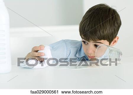 Little boy wiping up spilled milk with towel View Large Photo Image Stock Image - Little boy wiping up spilled milk with towel. Fotosearch