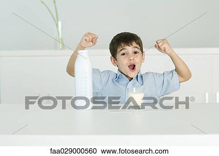 Little boy with glass of milk, fists in the air, open mouth, looking at camera View Large Photo Image Stock Image - Little boy with glass of milk, fists in the air, open mouth, looking at camera. Fotosearch