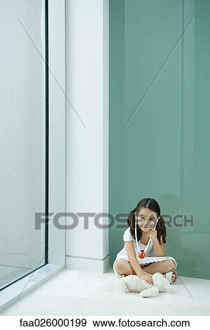 Little girl listening to teddy bear with toy stethoscope View Large Photo Image Stock Photo - Little girl listening to teddy bear with toy stethoscope. Fotosearch
