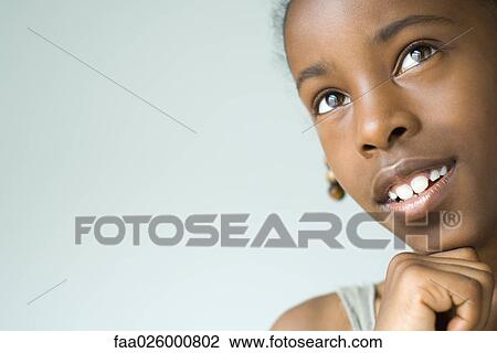 Little girl looking up, hand under chin, close-up, cropped View Large Photo Image Stock Image - Little girl looking up, hand under chin, close-up, cropped. Fotosearch