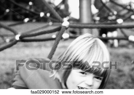 Little girl playing on playground, smiling at camera, cropped View Large Photo Image Stock Image - Little girl playing on playground, smiling at camera, cropped. Fotosearch