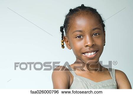 Little girl, smiling at camera, head and shoulders, portrait View Large Photo Image Stock Photograph - Little girl, smiling at camera, head and shoulders, portrait. Fotosearch
