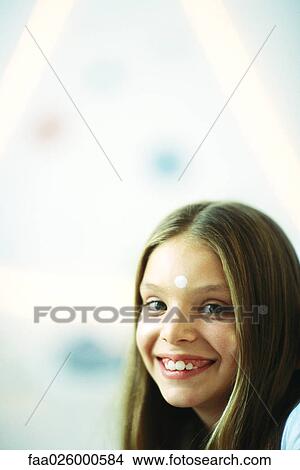 Little girl with white dot on her forehead, smiling at camera, portrait View Large Photo Image Picture - Little girl with white dot on her forehead, smiling at camera, portrait. Fotosearch