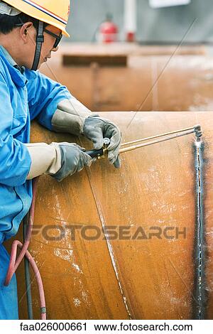 Man cutting metal with welding torch, side view, cropped View Large Photo Image Stock Image - Man cutting metal with welding torch, side view, cropped. Fotosearch