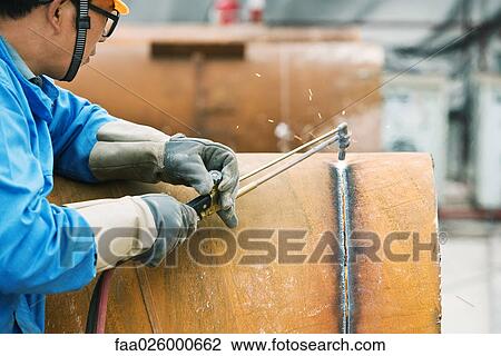 Man cutting metal with welding torch, side view, cropped View Large Photo Image Stock Image - Man cutting metal with welding torch, side view, cropped. Fotosearch