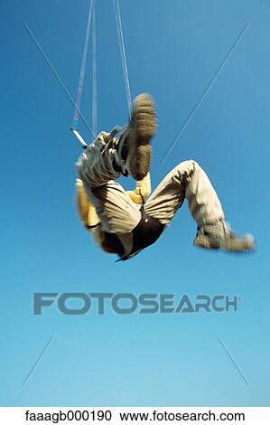 Man in mid air, kitesurfing View Large Photo Image Stock Image - Man in mid air, kitesurfing. Fotosearch