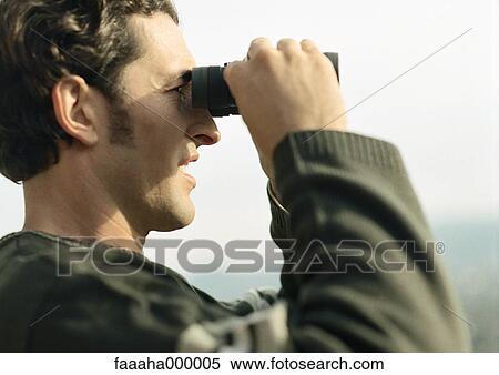 Man looking through binoculars, close-up, side view View Large Photo Image Stock Photography - Man looking through binoculars, close-up, side view. Fotosearch