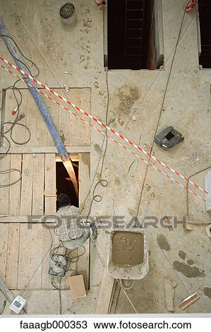 Stock Image - Man on construction site. Fotosearch