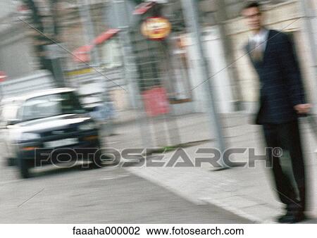 Man standing on curb, blur View Large Photo Image Stock Image - Man standing on curb, blur. Fotosearch
