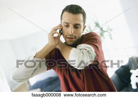 Man using cell phone View Large Photo Image Stock Photo - Man using cell phone. Fotosearch