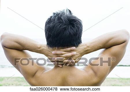 Man with hands clasped behind head, rear view View Large Photo Image Stock Photo - Man with hands clasped behind head, rear view. Fotosearch
